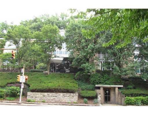 Exterior Front. Nice plantings give privacy to bui