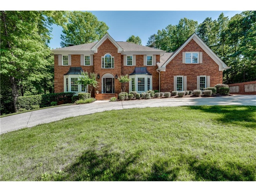 Beautiful brick home with a round about driveway f