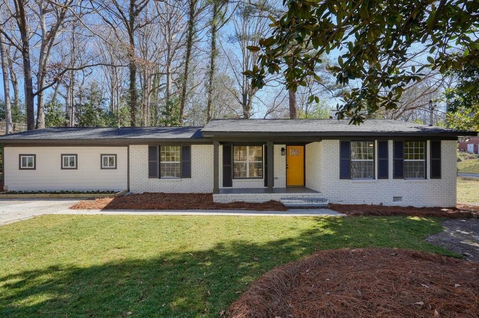 Single story home with a front yard