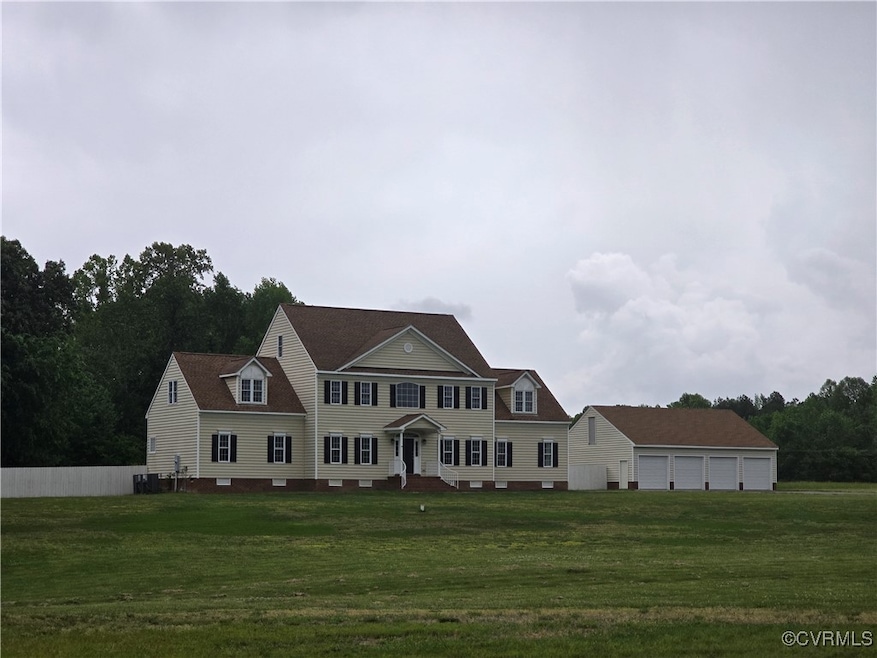 Colonial house featuring a front lawn and cooling