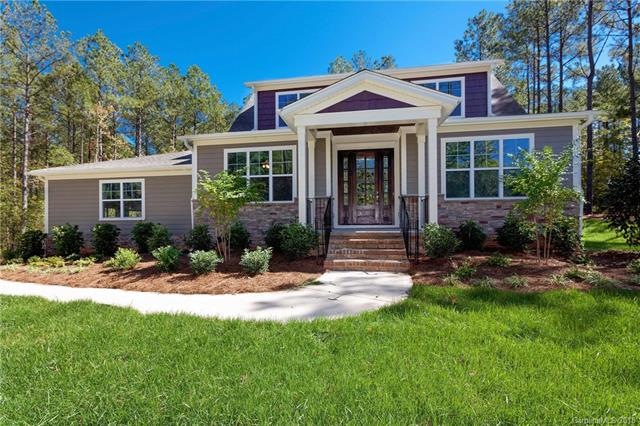 This 4 bedroom/4.5 bath home is a stunning craftsm