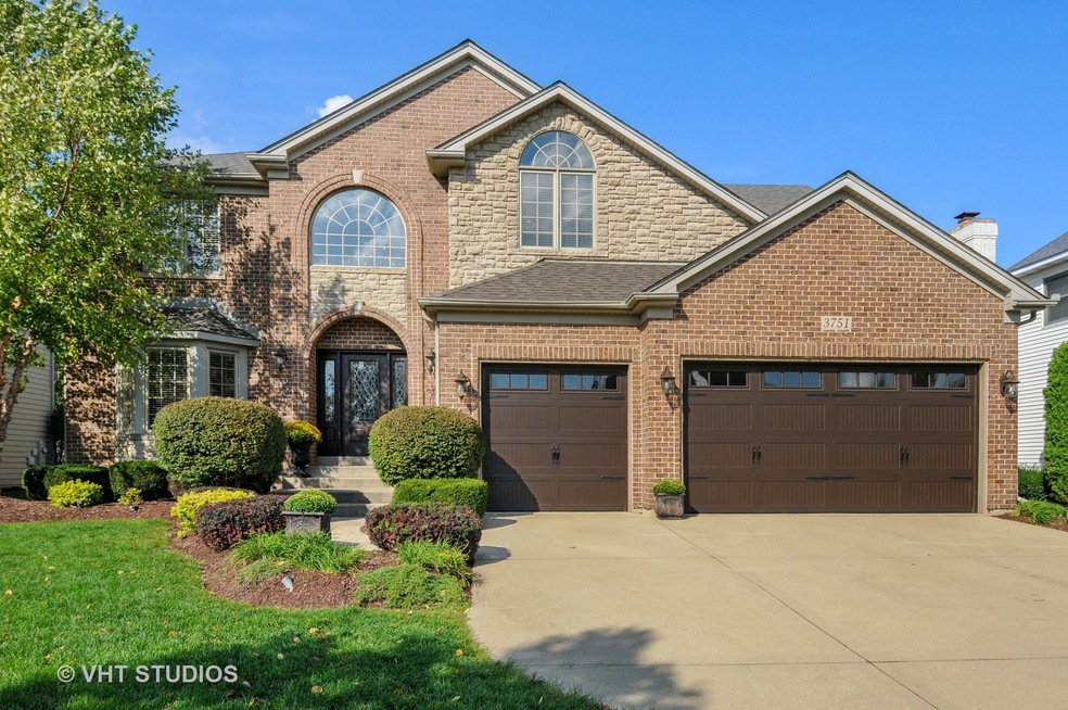 EXQUISITE BRICK AND STONE/ 3 CAR GARAGE