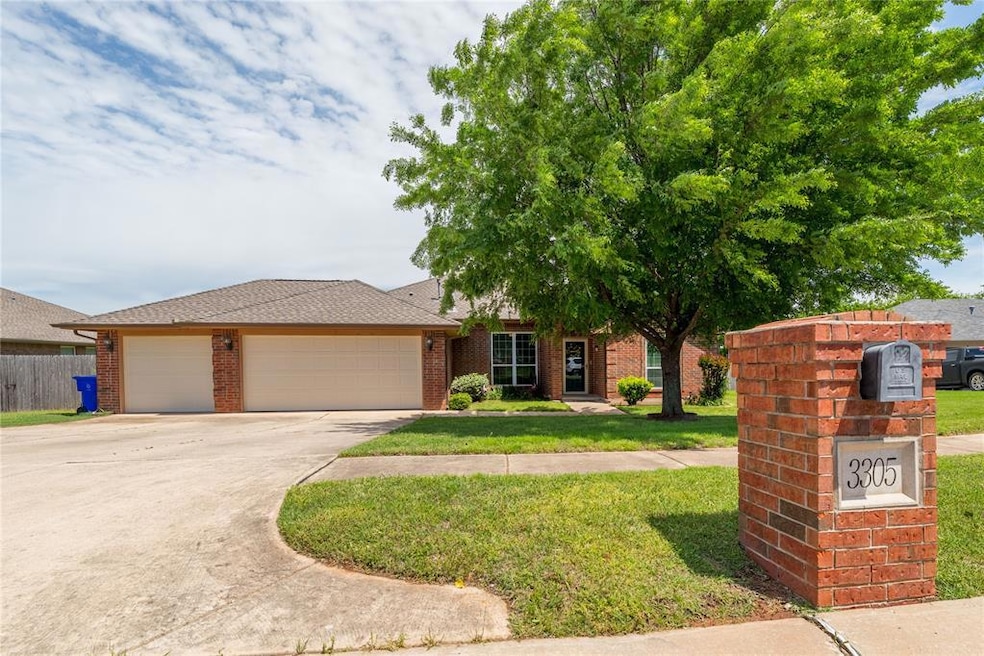 View of front of home with a garage, concrete driv