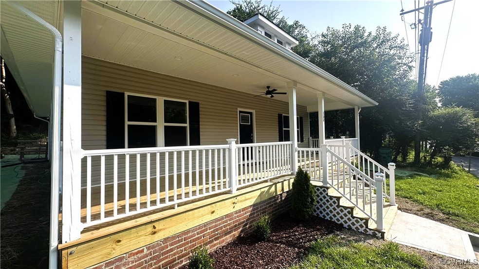 Doorway to property with a porch and ceiling fan