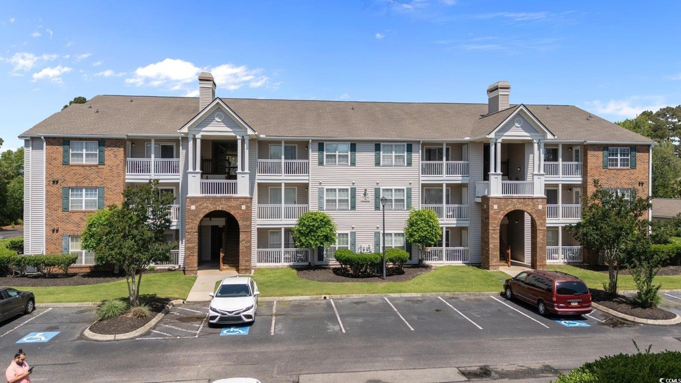 View of building exterior featuring uncovered park