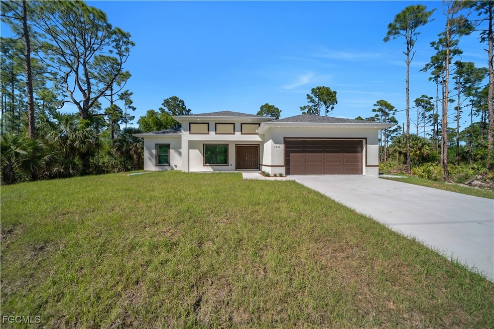 Prairie-style home with stucco siding, a garage, d