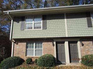 View of front of property with brick siding