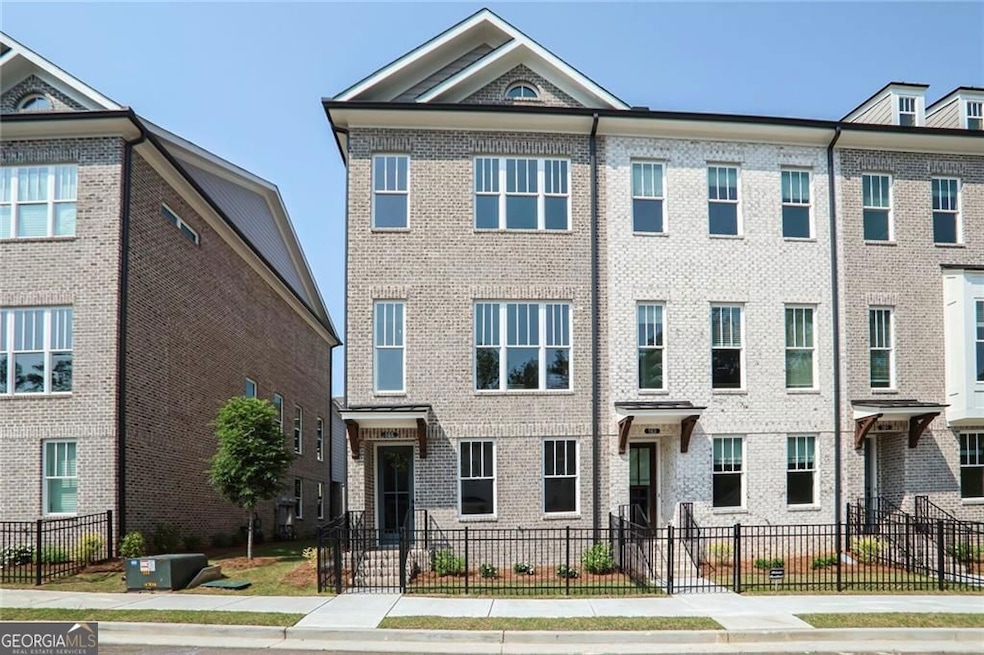 BRAND NEW TOWNHOUSE featuring a fenced front yard & gate community