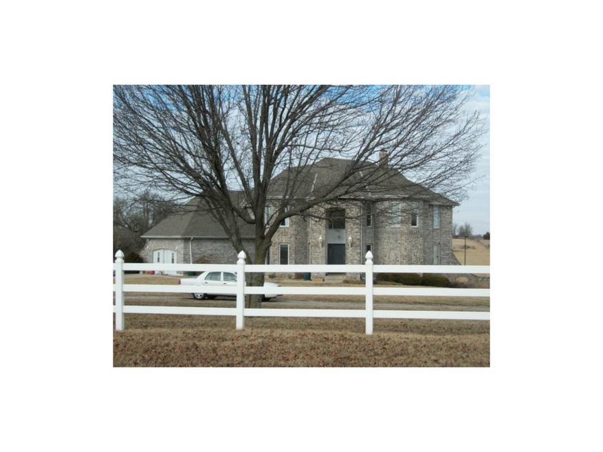 1228 E Walnut St, Raymore, MO 64083 - photo 1