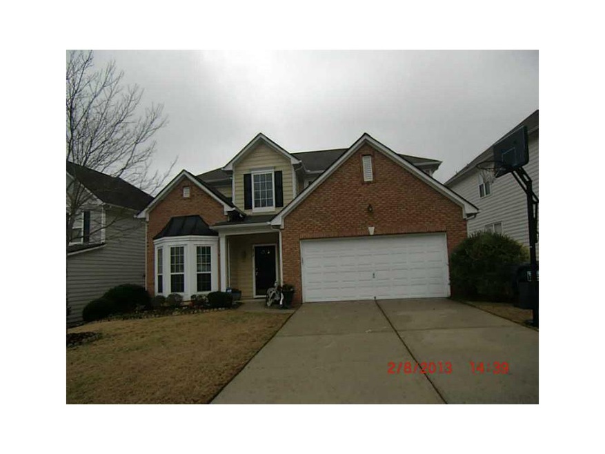 Exterior Front. Brick front with cement siding, ba
