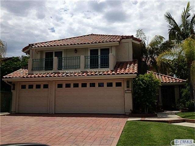 Front of home with balcony off of great room, stam