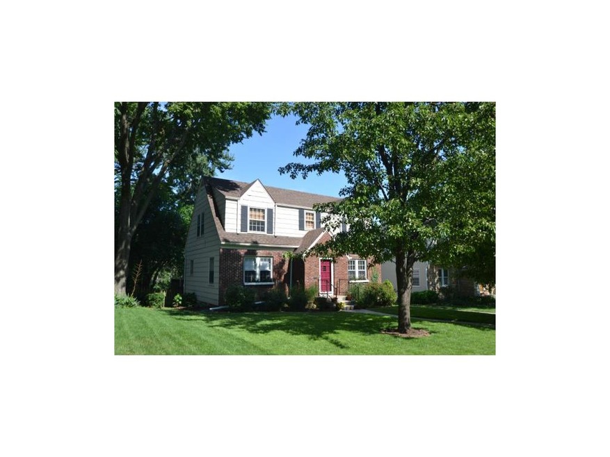 Darling Cape Cod with lovely landscaping and a lus