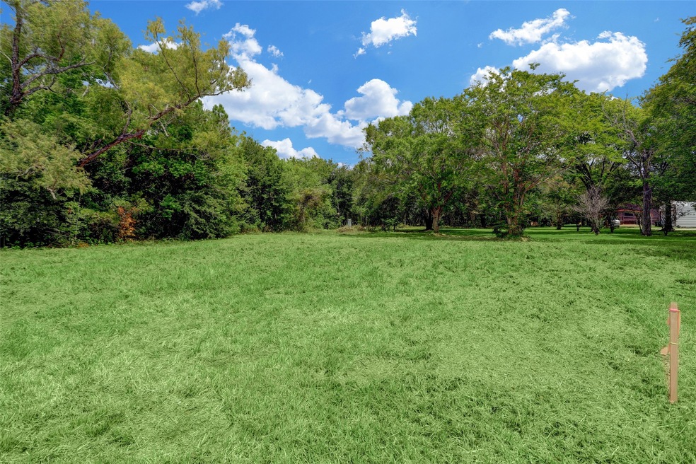 1.9998 unrestriced acres on Garth Road.  Front is cleared, back is partially cleared/underbrushed.  ***LAND ONLY***Enhanced to show what grassed property would look like.