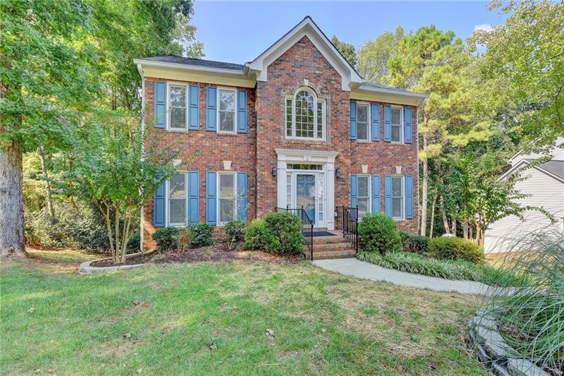 Gorgeous brick front home with mature landscaping!