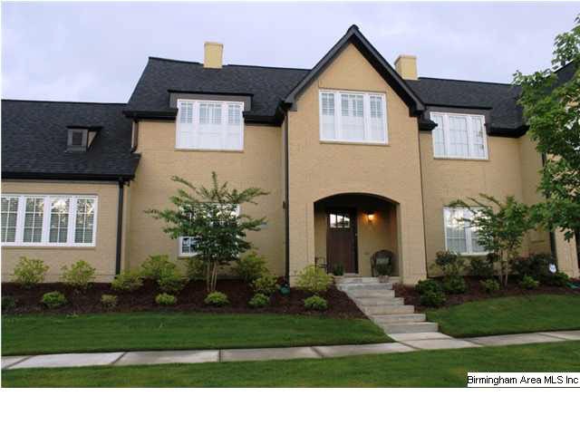 Almost new brick townhome with a marvelous lush fr