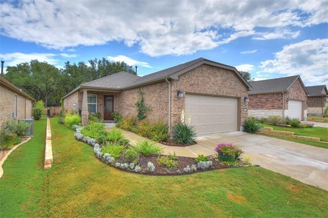 This Steel Creek plan has landscaping already in place along with a fenced back yard which backs to a greenbelt!