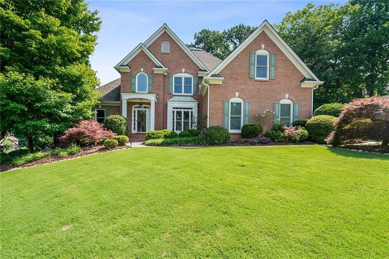 Beautiful 3 sided brick home in a swim and tennis 