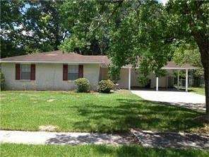 Brick home with added room that is vinyl sided. La