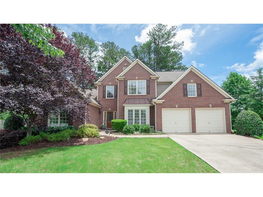Gorgeous brick front with extra long driveway for 