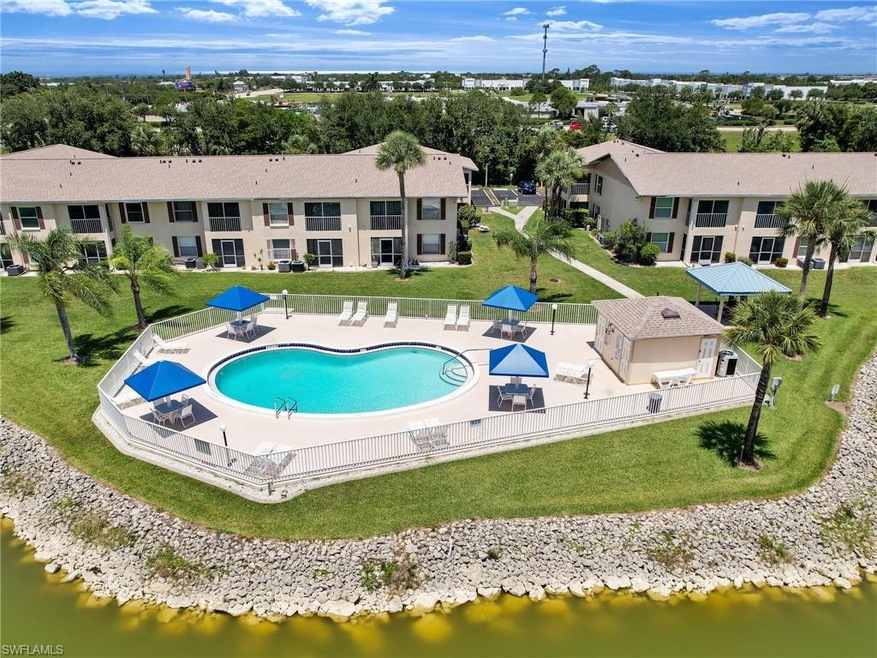 View of swimming pool with a yard and a patio area