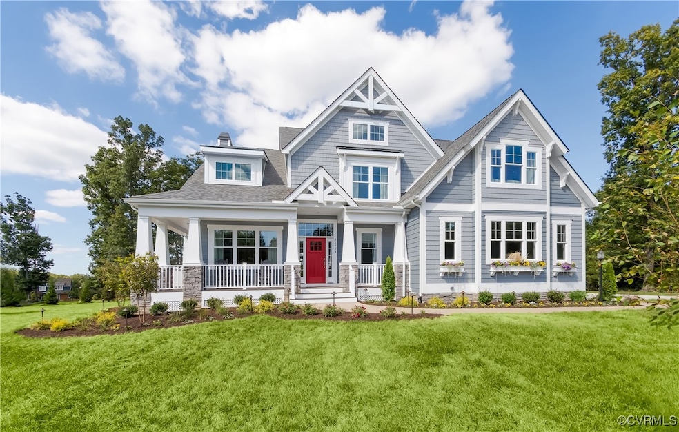 Craftsman inspired home featuring covered porch an
