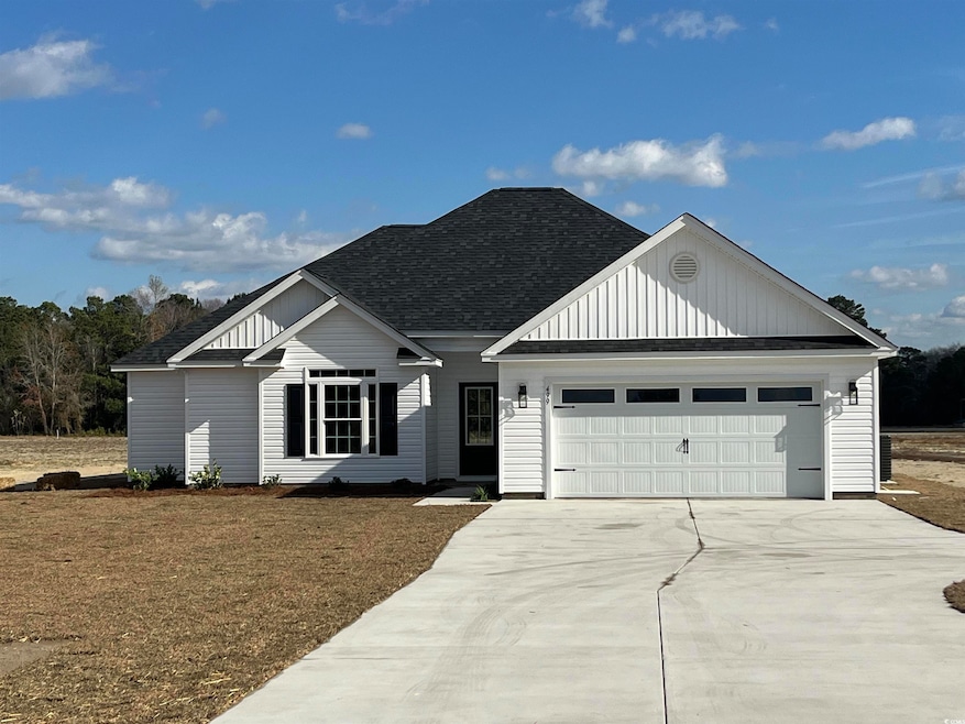 View of front facade featuring a garage