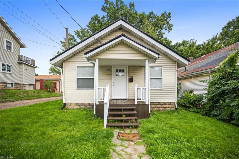 Bungalow-style house featuring a front yard