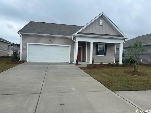 View of front of home featuring a garage and a fro