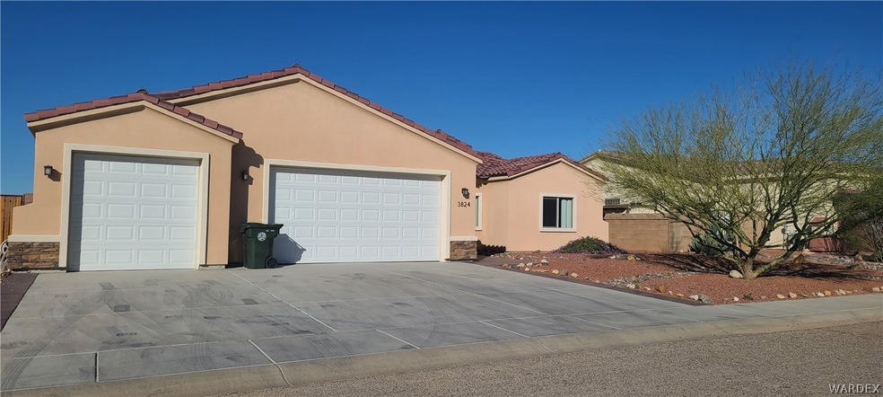 Front of home - three car attached garage.