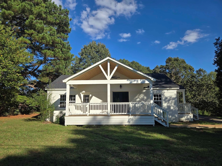Bungalow-style house featuring a front yard and covered porch