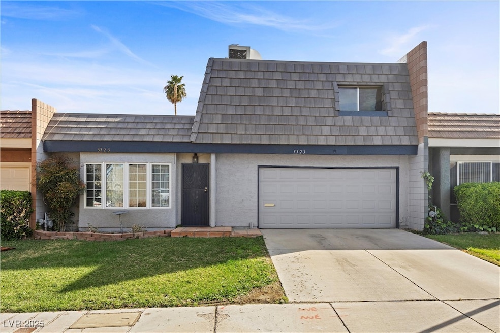 View of front of home featuring stucco siding, a f
