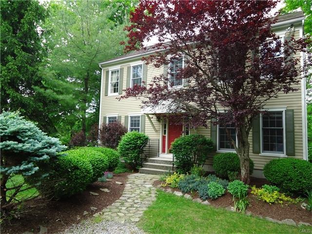 Perched above Fox Hill Lake, is this charming hous