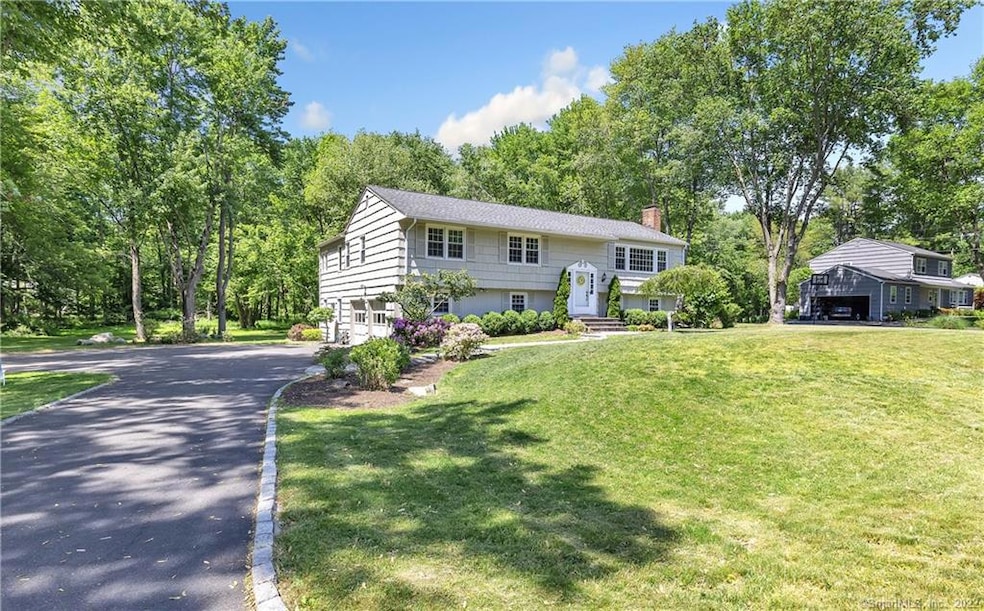 This home features a 2 car garage with plenty of p