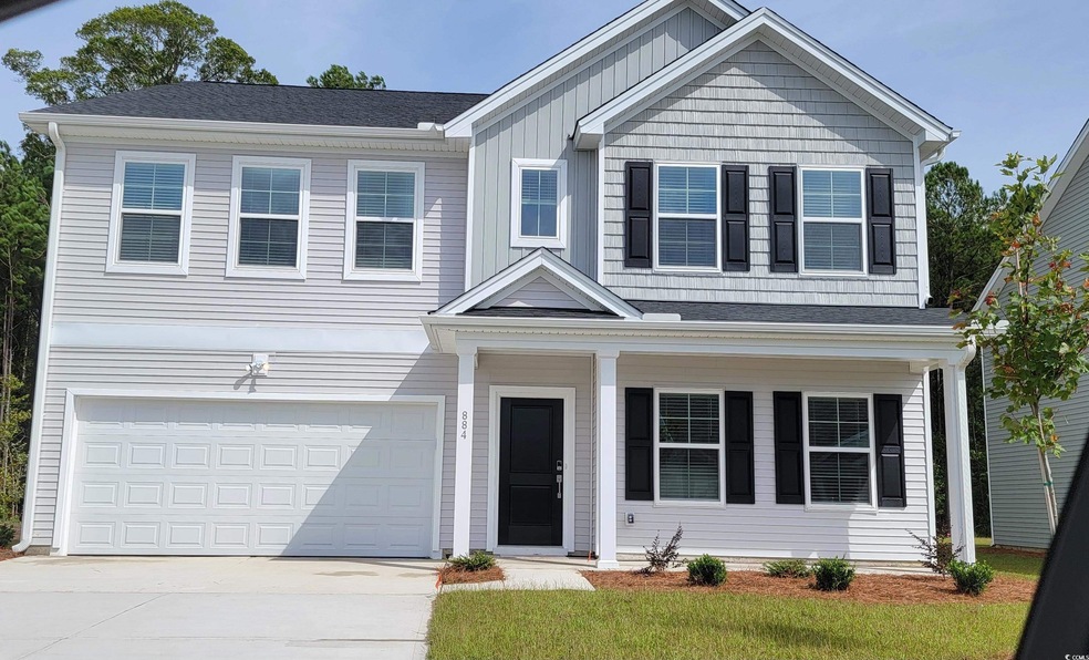 View of front of property with a garage