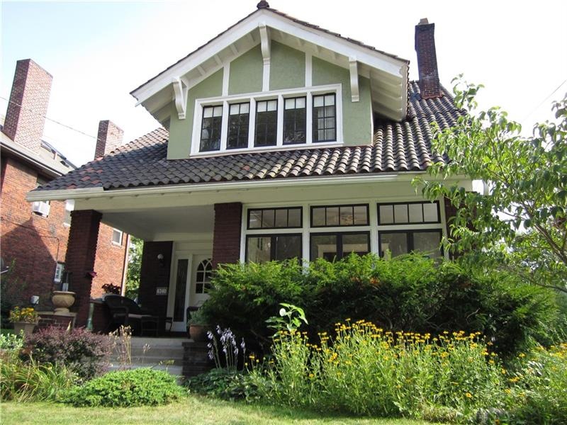 An Arts & Crafts bungalow with Spanish Tile roof, 