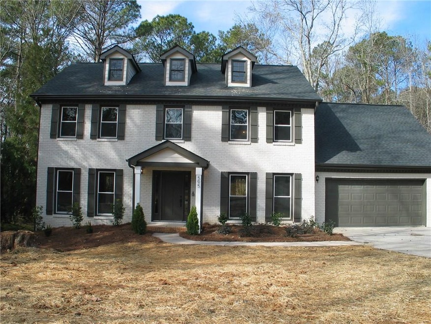 Curb Appeal Galore in this trendy painted brick tr