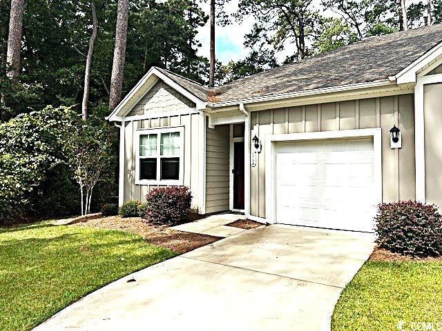 View of front of house featuring a garage and a fr
