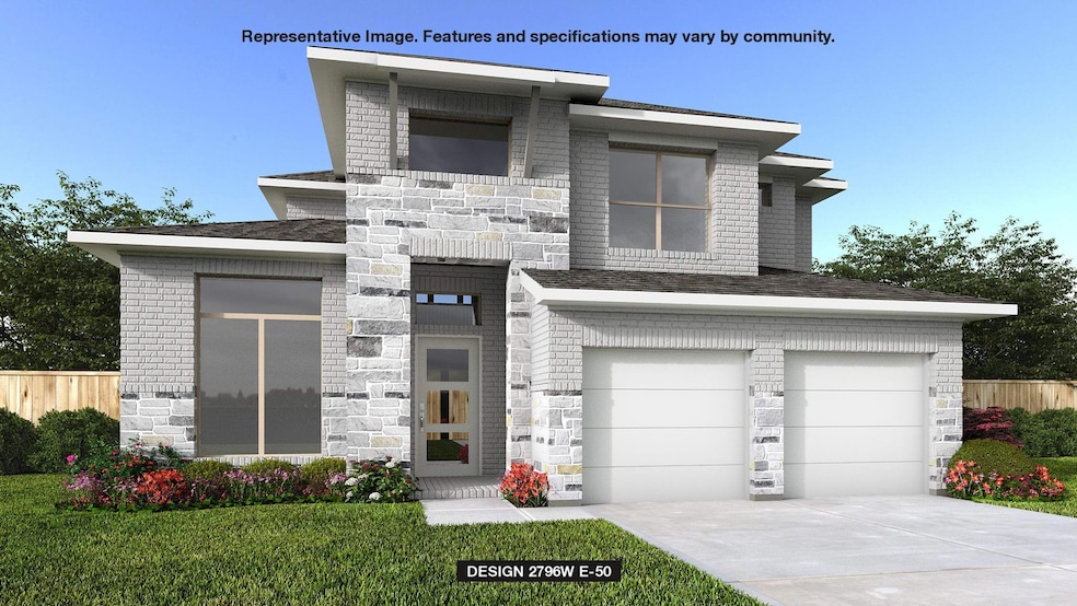 Modern home with driveway, brick siding, a garage