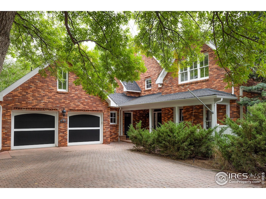 Tucked down a private brick lane on one of Boulder's most coveted streets, 1070 Juniper offers a rare half-acre retreat blending timeless charm, thoughtful updates, and an incredible indoor-outdoor lifestyle.