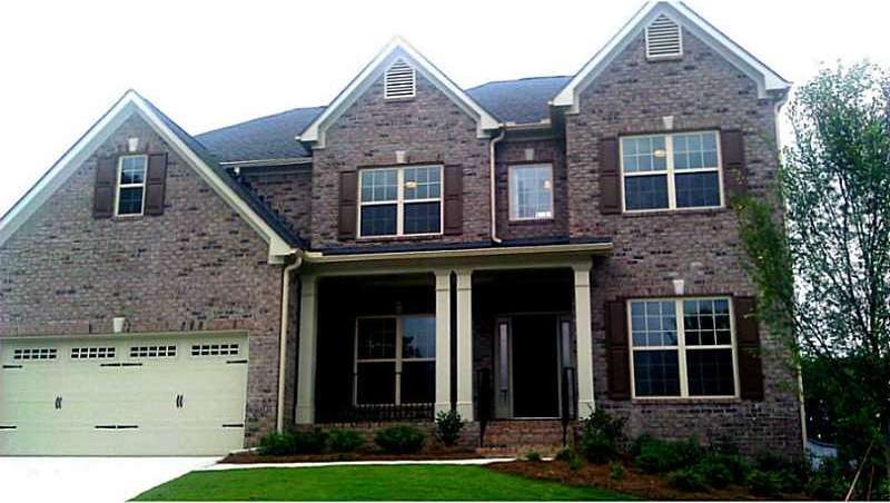 Exterior Front. THREE SIDES BRICK!