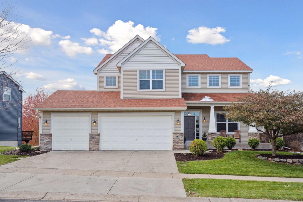 Curb appeal! Concrete driveway and wrap around porch.