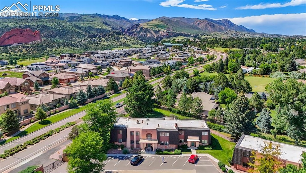 Aerial view of residential area featuring a mountainous background