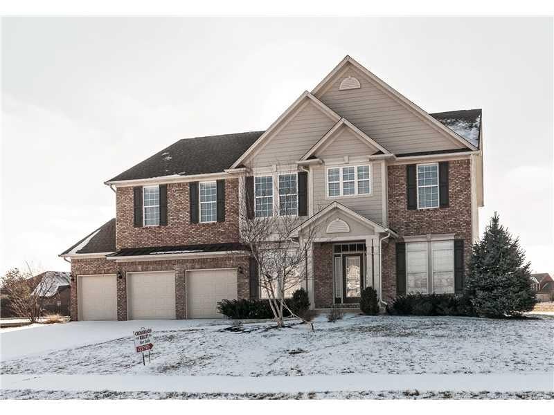 Exterior Front. This former model home has never been lived in. Brick and composite cement siding, rear deck, finished 3 car garage, terrific yard.