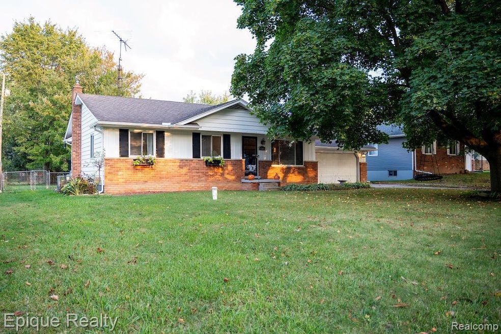 Single story home with brick siding, a porch, a chimney, an attached garage, and a shingled roof