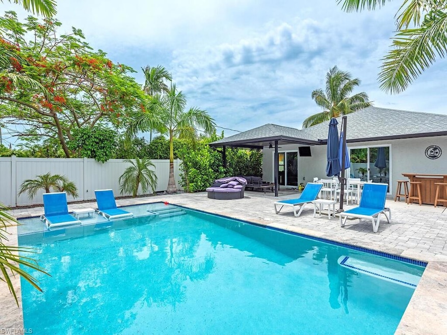 View of swimming pool with a patio area and a jacu