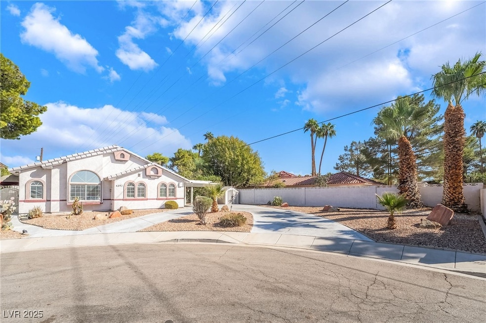 Mediterranean / spanish home with driveway, stucco siding, and a tiled roof