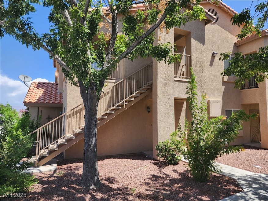 View of property with stairs