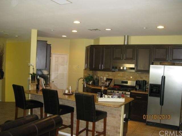 Modern kitchen with stone floors and granite count