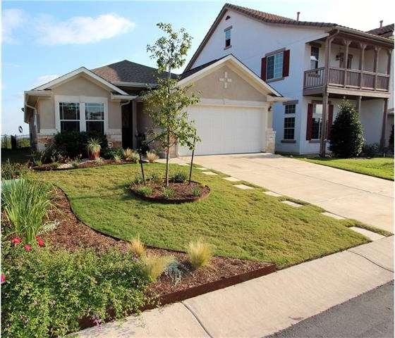 Welcome home! Notice the extensive front landscapi