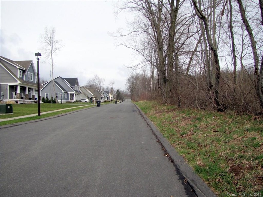 Land on the right.  At the end of this road photo,